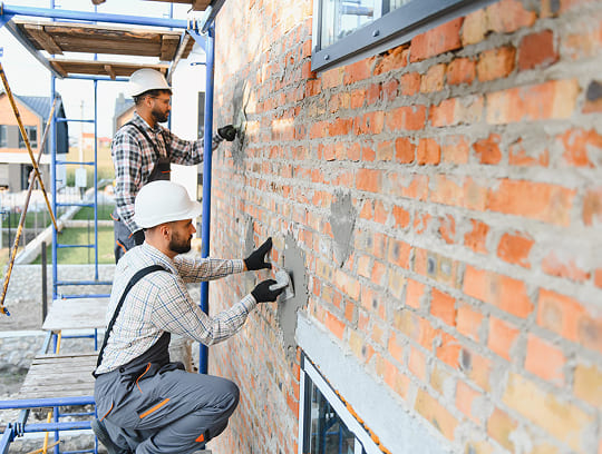 Contractor rebuilding a damaged commercial interior